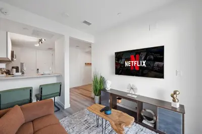 a living room with a couch and a table at Hollywood 1bdr apt with Pool, Free Parking, Gym in Los Angeles