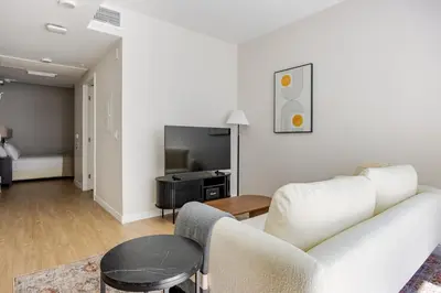 a living room with a couch and a table at Blueground Downtown elevator nr parks LAX-1251 in Los Angeles