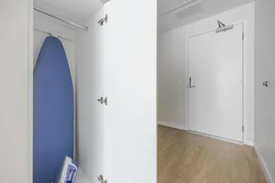 a room with a surfboard on the wall at Blueground Downtown elevator nr parks LAX-1252 in Los Angeles