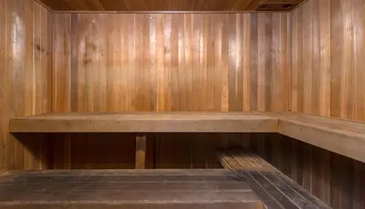 a wooden sauna with a wooden bench in it at Blueground Glendale pool AC nr Americana LAX-1319 in Glendale