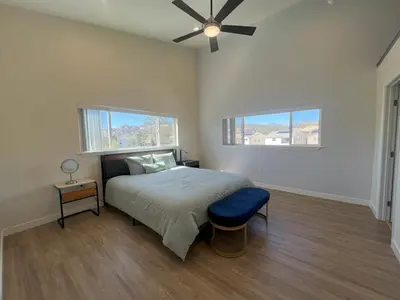a bedroom with a bed and a ceiling fan at Rancho del Cielo in Twin Lakes