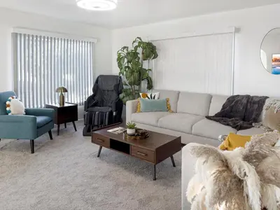 a living room with a couch and a coffee table at Quaint Mid-Century Cottage by the Coast in Ventura