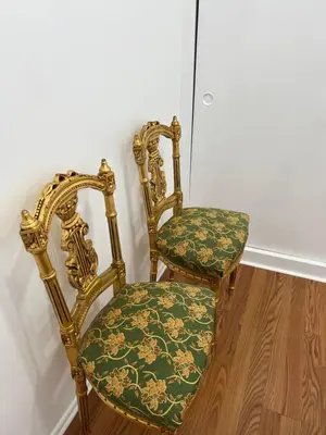 a chair sitting on a wooden floor next to a wall at Sunny Franklin Place in Los Angeles