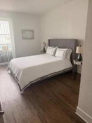 a bedroom with a large bed with white sheets and pillows at Villa Marina - AMAZING Modern, Spacious, Stylish 2 Master Suites in CENTRAL Marina Del Rey in Los Angeles