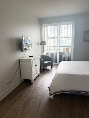 a bedroom with a bed and a desk with a chair at Villa Marina - AMAZING Modern, Spacious, Stylish 2 Master Suites in CENTRAL Marina Del Rey in Los Angeles