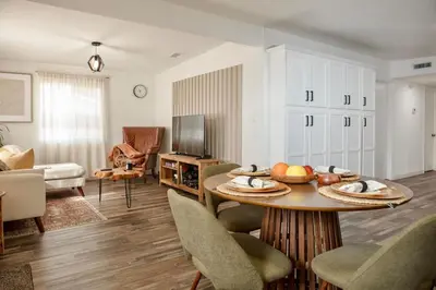 a living room with a table with fruit on it at Central Modern All-In-One Home in Lakewood