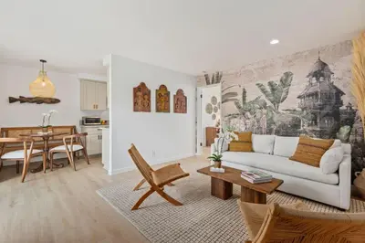 a living room with a couch and a table at Seaside and Newly Renovated in Summerland