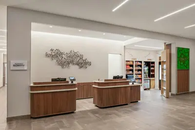 a lobby of a store with reception desks at Courtyard by Marriott San Bernardino Loma Linda in Loma Linda