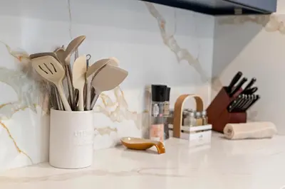 a white container filled with utensils on a counter at Hidden South Bay Gem near Manhattan and Redondo Beach in Redondo Beach