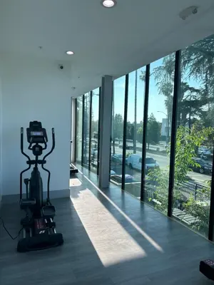 a camera on a tripod in a room with windows at Newly Gated Stylish Steps to Hollywood 2B2B in North Sherman Way