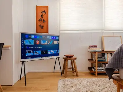 a television on a stand in a living room at Luxury A-Frame Retreat in Lake Arrowhead