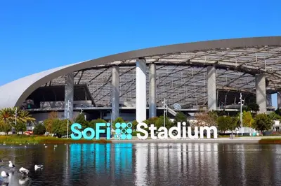 a stadium with a sign in front of a body of water at BonVoyage-Sleep&Sail Overnight Stays-Sleeps 6-8 in Long Beach