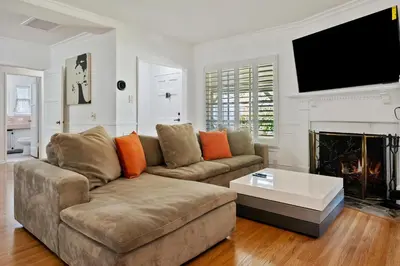 a living room with a couch and a fireplace at Modern piano Los Angeles home by universal studio & Hollywood for 10 in Studio City