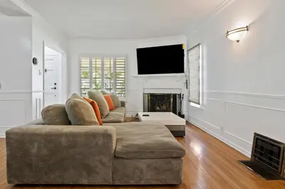 a living room with a couch and a fireplace at Modern piano Los Angeles home by universal studio & Hollywood for 10 in Studio City