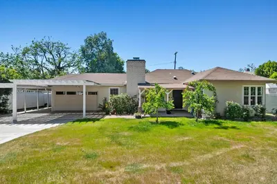 a house with a grassy yard at Modern piano Los Angeles home by universal studio & Hollywood for 10 in Studio City