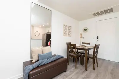a living room with a table and a couch at Hollywood Cozy Apartment in Los Angeles
