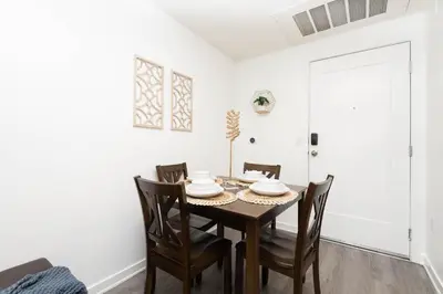 a dining room with a table and chairs at Hollywood Cozy Apartment in Los Angeles