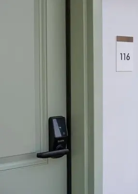 a hotel room with a phone on a window at The LEEF Hotel in Glendale