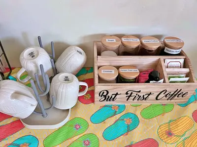 a wooden box filled with white pots and cups at Cozy Beautiful Private Home in Prime Location in Glendora
