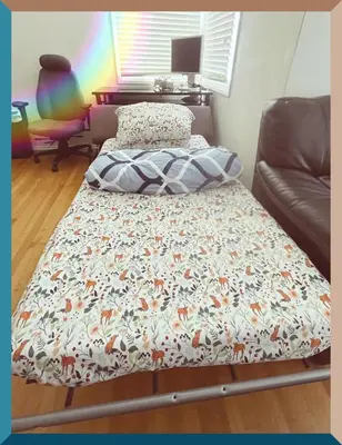 a bed with a blanket on it in a room at Cozy Beautiful Private Home in Prime Location in Glendora