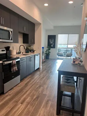 a kitchen with a table and a dining room at The sunset loft apartment FREE parking in Los Angeles