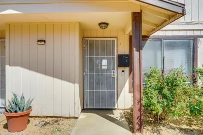 a front door of a house with a plant at Patio and Mtn Views Family Gem in California City in California City