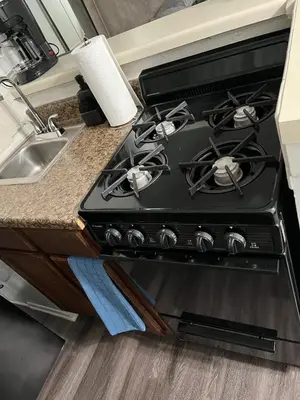 a stove top oven in a kitchen next to a sink at Starlight Studio near Sunset in Los Angeles