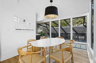 a white dining room with a white table and chairs at Malibu Beach House by Stay Awhile Villas in Malibu