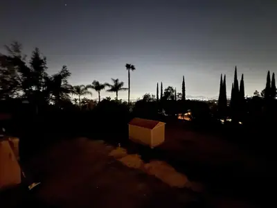 a box sitting in the middle of a field at night at Riverside Views & Pool Retreat in Riverside
