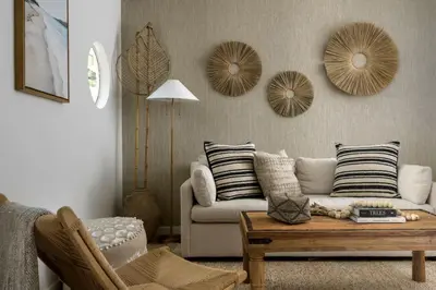 a living room with a couch and a table at Private Balcony and Coastal Escape in Summerland