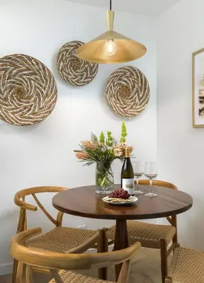 a table with chairs and a bottle of wine at Bali Home and SB Beaches in Summerland