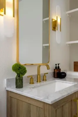 a bathroom with a sink and a mirror at Bali Home and SB Beaches in Summerland