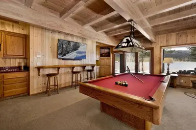 a room with a pool table in a cabin at Bear Lake Lodge Lakefront Incredible Lake House Chalet in Big Bear Lake