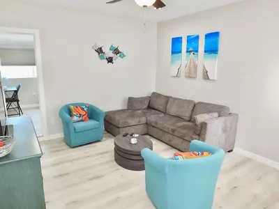 a living room with a couch and two chairs at Beach & Bay Retreat - Full of Amenities in Long Beach
