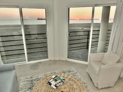 a living room with a view of the ocean at Beachfront Estate - LB Peninsula in Long Beach