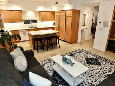 a living room with a couch and a table at Beauty by the Beach - SoCal Fun in Long Beach
