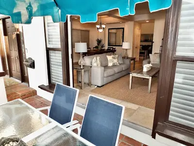 a living room with a couch and a table and chairs at Beauty by the Beach - SoCal Fun in Long Beach