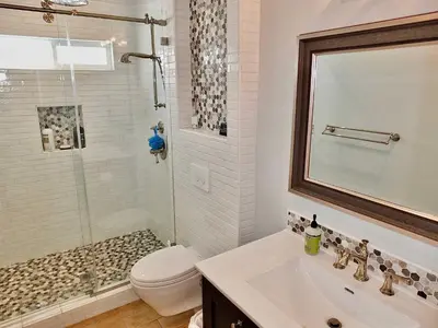 a bathroom with a toilet and a sink and a shower at Belmont Shore Beach House - Incredible Oceanfront Views in Long Beach