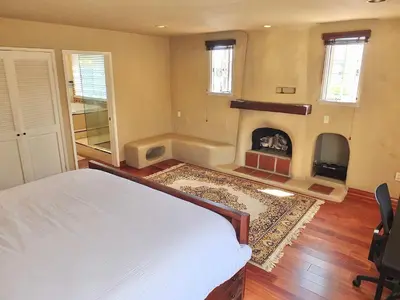 a bedroom with a bed and a fireplace at La Brisa - One Block from the Beach in Long Beach