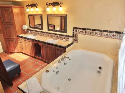 a large bathroom with a tub and two sinks at La Brisa - One Block from the Beach in Long Beach