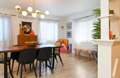 a dining room with a table and chairs at Immaculate 3BDR Bungalow - 5-Min Walk to Beach in Long Beach