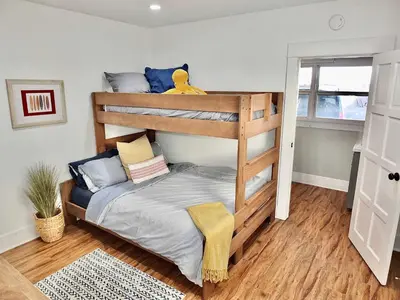 a bedroom with two bunk beds in a room at Park Avenue Beach Paradise - Chic & Secluded 4 BDR in Long Beach