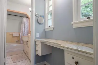 a bathroom with a counter and a sink and a window at The Otsego Hideaway in Los Angeles