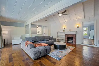 a living room with a couch and a table at The Otsego Hideaway in Los Angeles