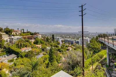 a view of a city with trees and buildings at Walk to Sunset Strip Modern Home in WeHo Hills! in Los Angeles