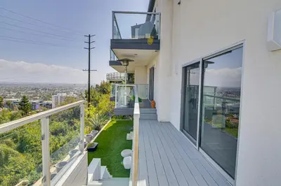 a balcony with a view of the city at Walk to Sunset Strip Modern Home in WeHo Hills! in Los Angeles