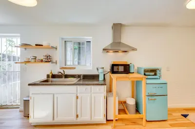 a kitchen with a sink and a microwave at 5 Mi to Dtwn Los Angeles Apt with Outdoor Space! in Los Angeles