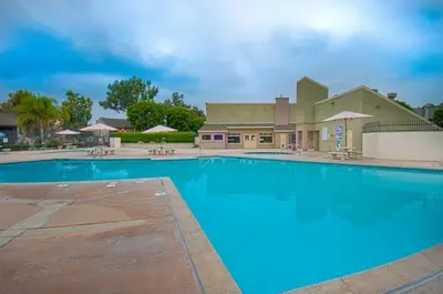 a large blue swimming pool in front of a building at Love Bug by Funtierland Vacation Rentals in Anaheim