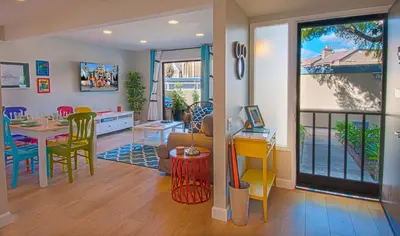 a kitchen and dining room with a table and chairs at Love Bug by Funtierland Vacation Rentals in Anaheim