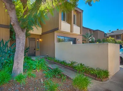 a house with a tree in front of it at Love Bug by Funtierland Vacation Rentals in Anaheim